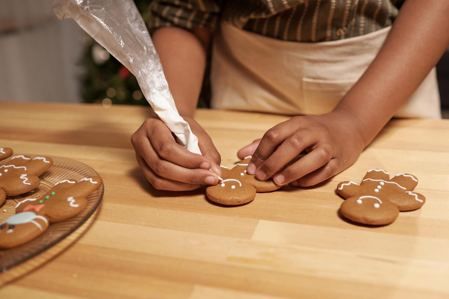hands-african-girl-cooking-gingerbread-cookies-by-table